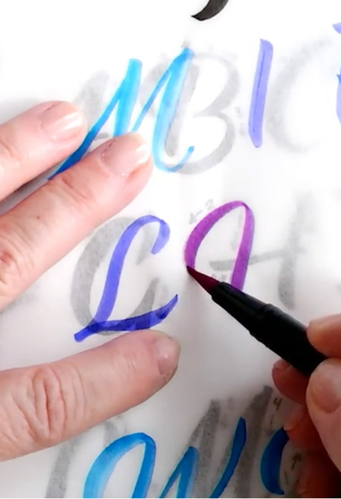 artist creating a hand-lettered poster